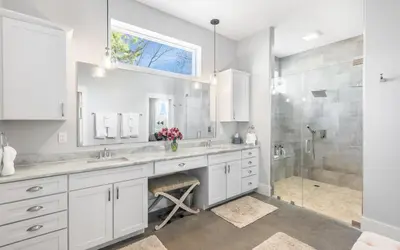 a white bathroom with a sink and a shower at Winters End by Oversee 30A in Santa Rosa Beach