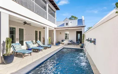 a swimming pool in the backyard of a house at Winters End by Oversee 30A in Santa Rosa Beach