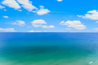 a view of the ocean with a blue sky and clouds at Treasure Island #2302 in Panama City Beach