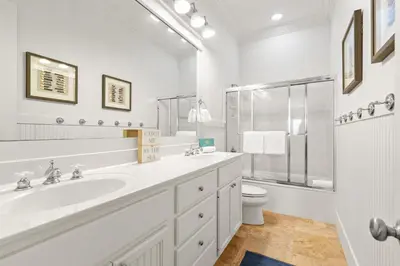a white bathroom with a sink and a toilet at Steps to Beach, Large Private Pool, Bikes, Luxury in Santa Rosa Beach