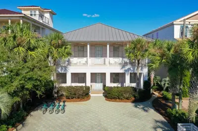 an aerial view of a house with palm trees at Steps to Beach, Large Private Pool, Bikes, Luxury in Santa Rosa Beach