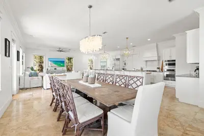 a kitchen and dining room with a table and chairs at Steps to Beach, Large Private Pool, Bikes, Luxury in Santa Rosa Beach