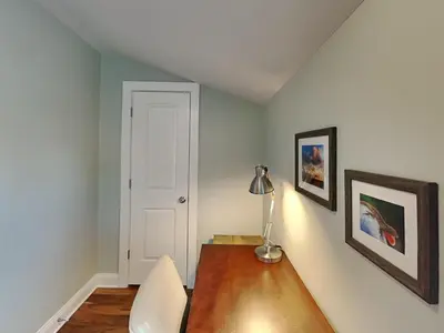 a room with a table and a lamp on a desk at Villa Chateau #10 in Panama City Beach