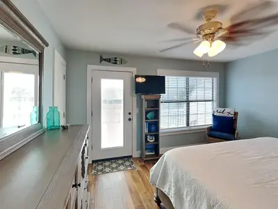 a bedroom with a bed and a ceiling fan at Villa Chateau #10 in Panama City Beach