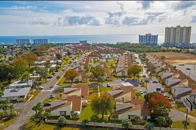 an aerial view of a small town with houses at 3 Bdrm Condo- 4 pools, hot tub & walk to Beach in Panama City Beach
