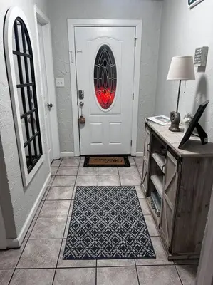 a room with a white door with a red light at 3 Bdrm Condo- 4 pools, hot tub & walk to Beach in Panama City Beach