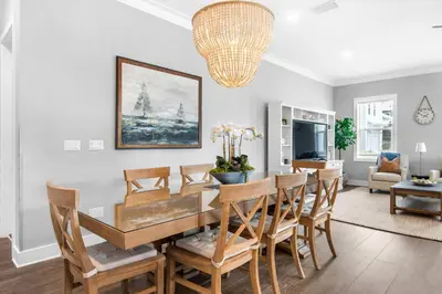 a dining room with a table and chairs at Wendell's Place in Inlet Beach