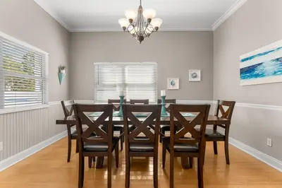 a dining room with a table and chairs at 30A Beach House - Seagrove Escape by Panhandle Getaways in Seagrove Beach