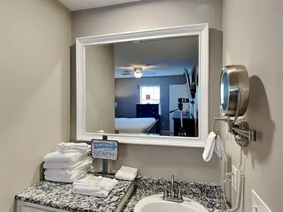 a bathroom with a sink and a mirror at Horizon South #76E in Panama City Beach