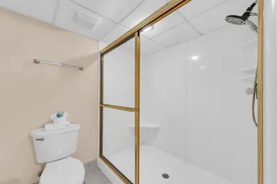 a bathroom with a shower and a toilet at Long Beach Resort 2-1206 in Panama City Beach
