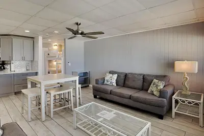 a living room with a couch and a table at Continental #221 in Panama City Beach