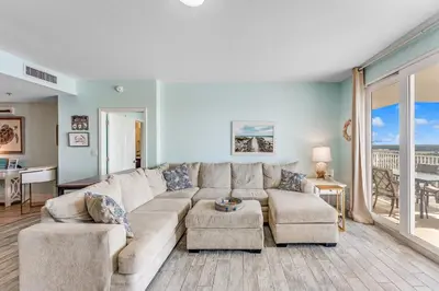 a living room with a couch and a table at Laketown Wharf #1034 in Panama City Beach