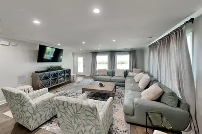 a large living room with a couch and chairs at Laguna Matata in Panama City Beach