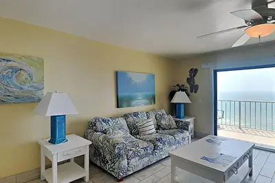 a living room with a couch and a table at Summit Beach Resort #1202 in Panama City Beach