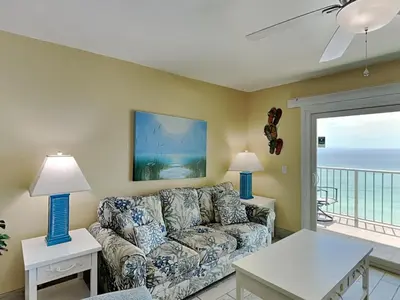 a living room with a couch and a view of the ocean at Summit Beach Resort #1202 in Panama City Beach