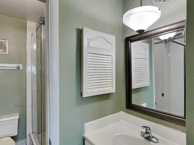 a bathroom with a sink and a mirror at Summit Beach Resort #1202 in Panama City Beach