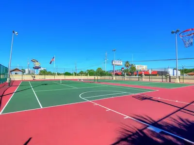 a tennis court with a net on top of it at Summit Beach Resort 1231 in Panama City Beach