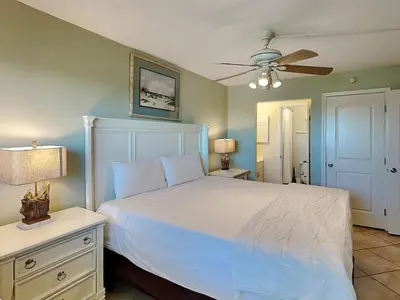 a bedroom with a white bed and a ceiling fan at Summit Beach Resort 1231 in Panama City Beach