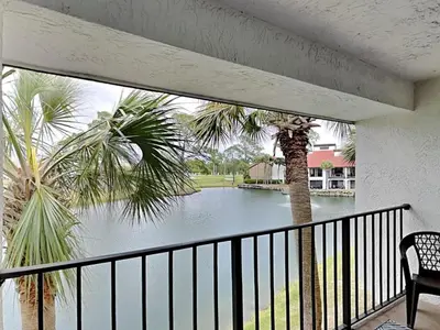 a balcony with a view of a body of water at Edgewater Villa #909 in Panama City Beach