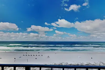a group of people on a beach near the ocean at Edgewater Tower II #606 in Panama City Beach