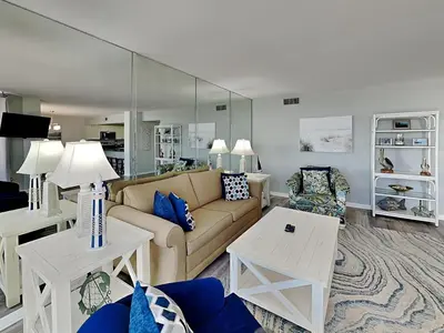 a living room with a couch and a table at Edgewater Tower II #606 in Panama City Beach