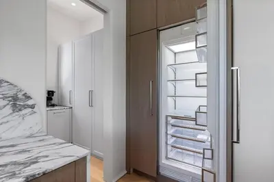 a kitchen with a refrigerator with its door open at Oceanview Oasis in Seagrove Beach