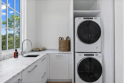 a kitchen with two washing machines and a sink at Oceanview Oasis in Seagrove Beach