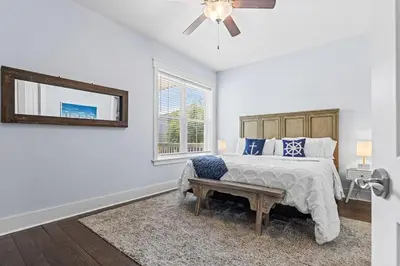a bedroom with a bed and a ceiling fan at Gone Coastal in Santa Rosa Beach