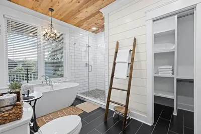 a bathroom with a bath tub and a sink at Let It Be in Inlet Beach