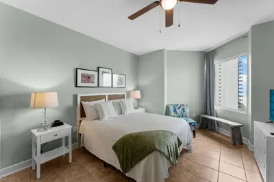 a bedroom with a bed and a ceiling fan at Stunning 3BR Corner Tidewater Resort Beachfront Condo! Sleeps 10! by Dolce Vita Getaways PCB! in Panama City Beach