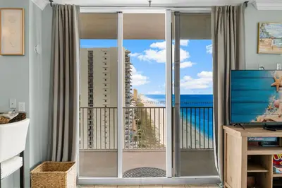 a living room with a view of the ocean at Stunning 3BR Corner Tidewater Resort Beachfront Condo! Sleeps 10! by Dolce Vita Getaways PCB! in Panama City Beach
