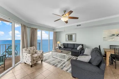 a living room with a view of the ocean at Stunning 3BR Corner Tidewater Resort Beachfront Condo! Sleeps 10! by Dolce Vita Getaways PCB! in Panama City Beach