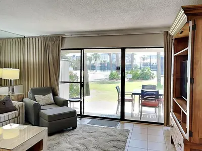 a living room with a couch and a table at Edgewater Villa #2601 in Panama City Beach