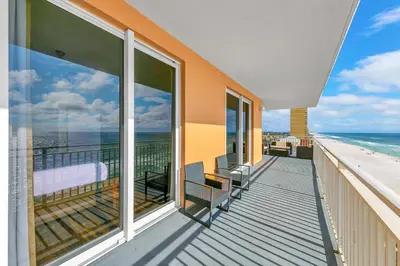 a balcony with views of the beach and the ocean at Splash 507E in Panama City Beach