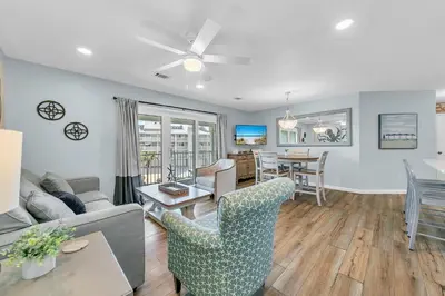 a living room with a couch and a table at Beachside Villas 832 in Santa Rosa Beach