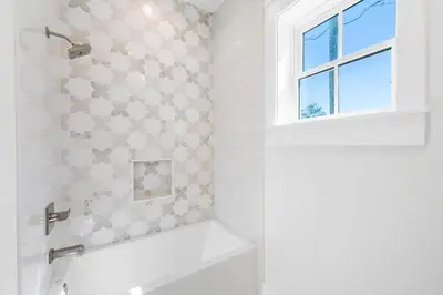 a bathroom with a white toilet and a window at 30A Sunrise 6 Bedroom in Santa Rosa Beach
