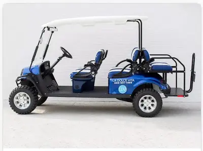 a blue golf cart with two doors on it at 30A Sunset 6 Bedroom in Santa Rosa Beach