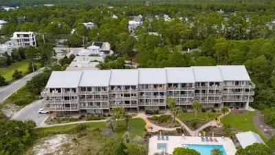 an aerial view of a resort with a large building at Ocean View Balcony Heated Pool Steps to the Beach The Sea Chord by AvantStay in Santa Rosa Beach