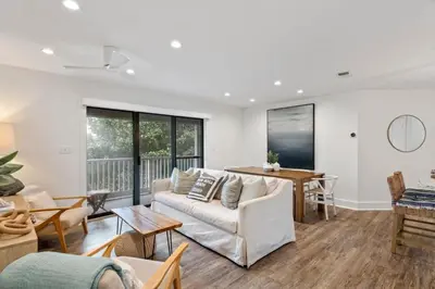 a living room with a couch and a table at Beach Condo with Heated POOL and Tennis Courts and Beach Access and 6 Beds that Sleep 8 in Santa Rosa Beach