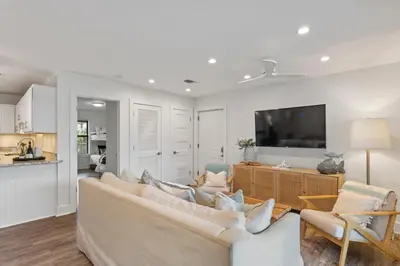 a living room with a couch and a tv at Beach Condo with Heated POOL and Tennis Courts and Beach Access and 6 Beds that Sleep 8 in Santa Rosa Beach