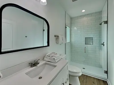 a white bathroom with a sink and a toilet at Sunset On Snapper A in Panama City Beach