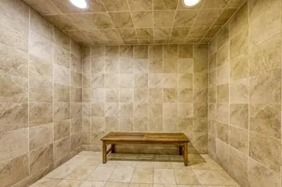 a room with a bench in the corner of a room at Stunning Beachfront 