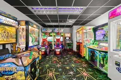 a room filled with lots of arcade games at Stunning Beachfront 