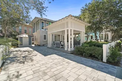 a house with a gazebo in a yard at Carillon Beach House - Grits Carlton by Panhandle Getaways in Panama City Beach