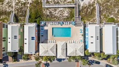 an aerial view of a resort with a swimming pool at Carillon Beach House - Grits Carlton by Panhandle Getaways in Panama City Beach