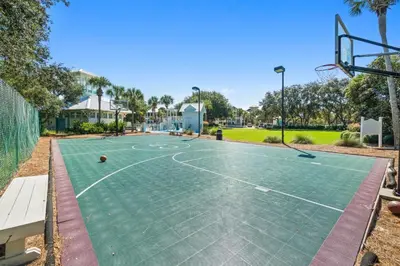 a basketball court in a park with a basketball hoop at Carillon Beach House - Grits Carlton by Panhandle Getaways in Panama City Beach