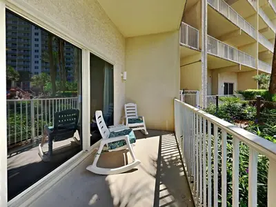 a balcony of a building with chairs on it at Shores of Panama #109 in Panama City Beach