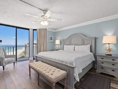a bedroom with a bed and a ceiling fan at Edgewater Tower III #1212 in Panama City Beach