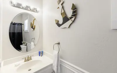 a bathroom with a sink and a mirror at Seashell Castle by Oversee 30A in Santa Rosa Beach