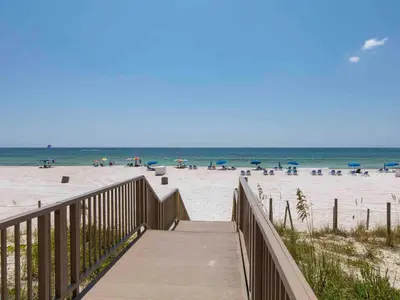 a boardwalk leading to a beach with people on it at Boardwalk #1008 in Panama City Beach